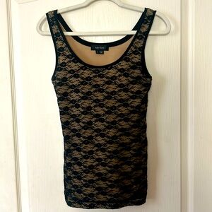 Trendy lace top, fully lined, stretchy. Looks great with slacks or skirts